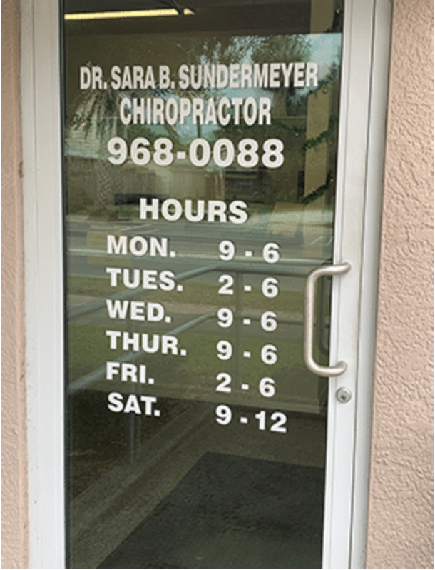 photo of entrance to Auburndale Medical Injury Center: Auburndale Chiropractic with chiropractor name, "Dr. Sara B Sundermeyer", phone number "968-0088" and office hours, "Mon 9-6, Tues. 2-6, Wed. 9-6, Thur. 9-6, Fri. 2-6, Sat 9-12" on the door.